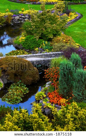 River, bridge, and flowers in Vancouver Queen Elizabeth Park. More with keyword group14h