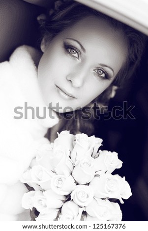 Beautiful bride woman portrait with bridal bouquet posing in her wedding day
