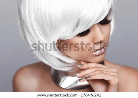 White Short Hair. Blond Girl. Beauty Fashion Portrait of Cute Woman. White Short Hair. Isolated on Grey Background. Face Close-up. Hairstyle. Fringe. Vogue Style.