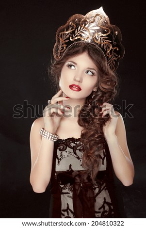 Fashion Russian girl model in exclusive design clothes on manners old-Slavic. Close-up portrait.