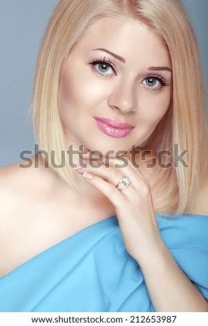 Beautiful blond woman portrait, makeup, skin care, bob hairstyle. Studio photo
