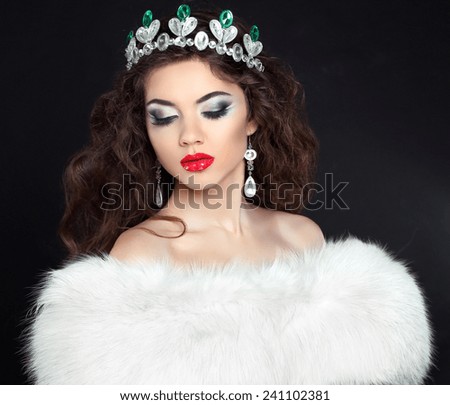 Luxury Jewelry. Fashion woman in white fur coat, lady portrait isolated on black background.