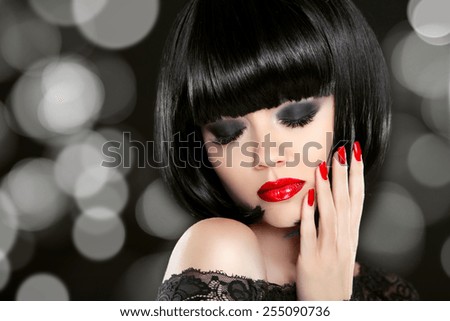 Makeup. Manicured nails. Beauty girl portrait. Back short bob hair. Hairstyle. Smokey eyes.