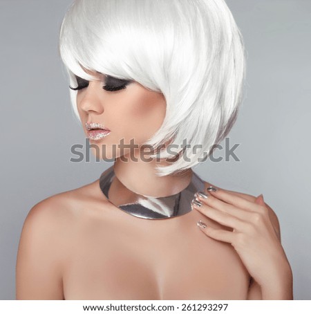 White Bob Hairstyle. Beauty Blond Girl Portrait with Smokey eyes Makeup and silver jewelry isolated on grey background.