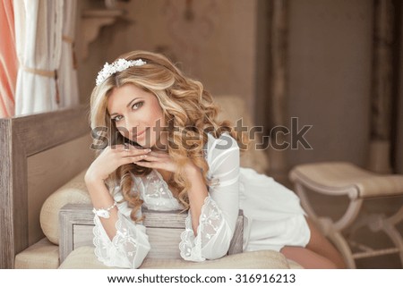 Beautiful smiling Bride Portrait wedding makeup, wedding hairstyle, Wedding dress. Attractive young woman in modern interior apartments.