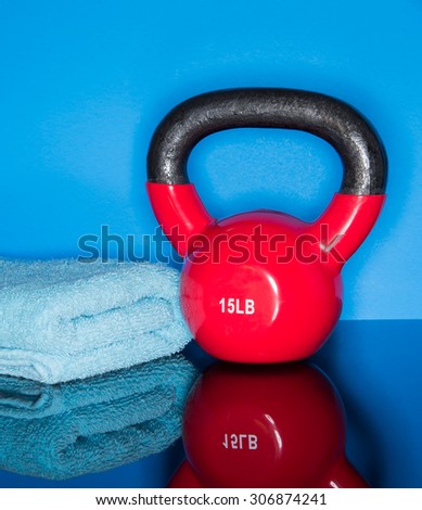 Red Kettle ball on blue background with towel