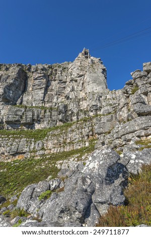 Cape Town\'s Table Mountain cable car as it takes tourists up to the top and back from the base of the mountain. Table Mountain is one of the seven wonders of the world located in South Africa