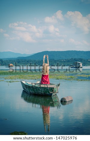 woman,boat and lake