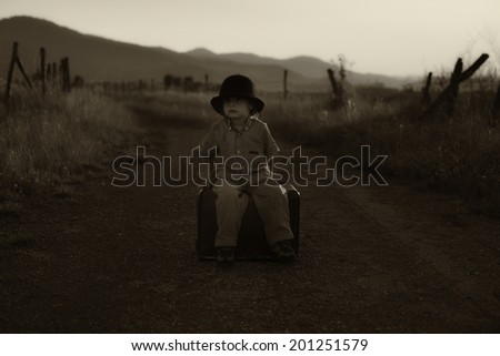 Boy with a Suitcase black and white photography