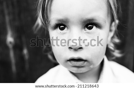 boy crying black and white photography