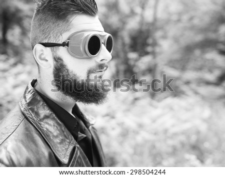 a young man with a beard black and white photography