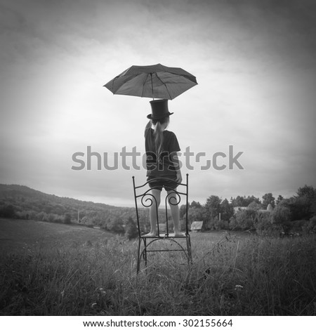 boy with umbrella black and white photography