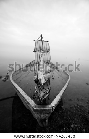 old boat and sail boat black and white