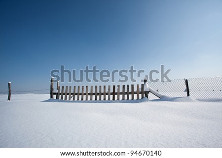 wooden fence and beauty snow