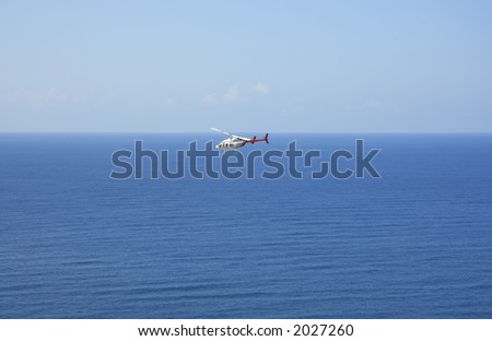 helicopter on background sea and sky, background for text