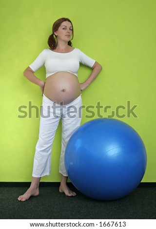 a pregnant woman with a blue ball.