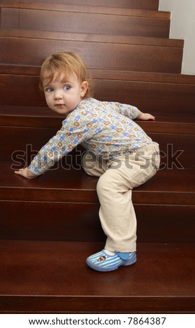 A Child Is Climbing Up Stairs. Stock Photo 7864387 : Shutterstock