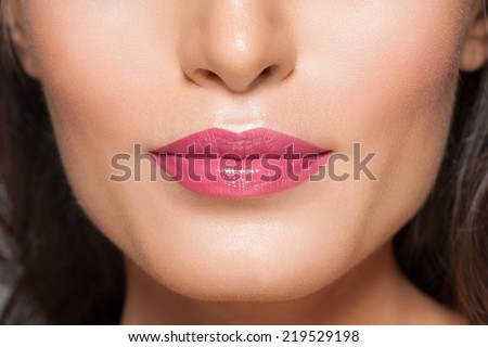 Closeup of beautiful sexy lips with pink lipstick
