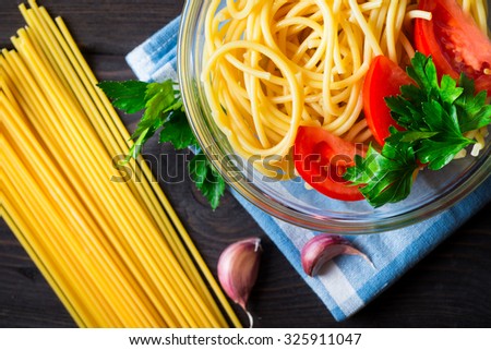 Fresh Pasta with tomatoes and parsley. Italian food