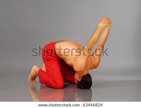RABBIT - Young man performing Yoga exercises