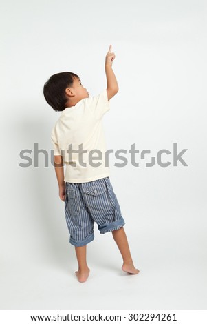 Child Pointing At Side. Back View. Isolated On White Background Stock ...