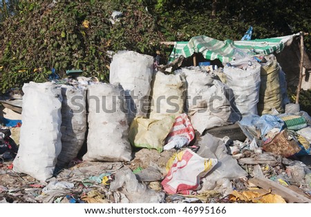 Sacks of scavenged plastic, cans, bottles for recycling