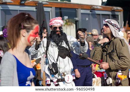 SESIMBRA, PORTUGAL - FEBRUARY 20: Man dressed up as Bin Laden in the Sesimbra Carnival – equal to the Brazilian Carnival on February 20, 2012 in Sesimbra, Portugal.