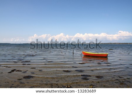 red fishing-boat in blue sea