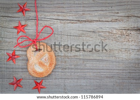 Christmas cookies and star on the tape. On textured wood.