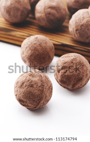 Chocolate truffles on white background