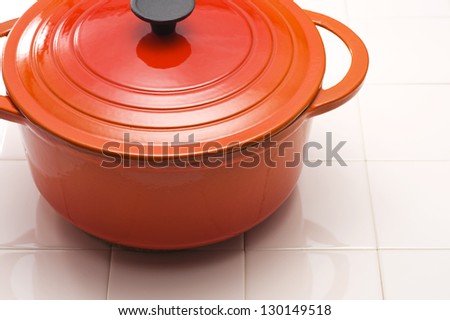 Close-up of red enamel pot