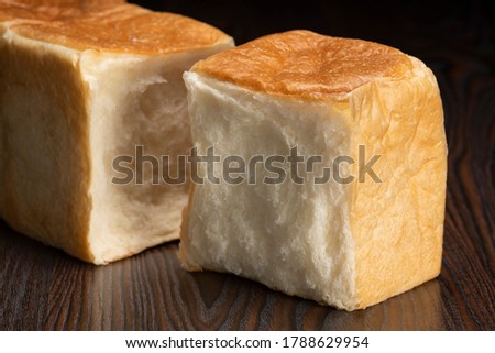 Image, Stock Photo Hand mit frischen halbierten Orangen auf einem Holzschneidebrett auf einem schwarzen Hintergrund