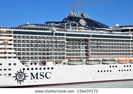 GENOA, ITALY - APRIL 16: the majestic new flagship MSC cruise liner (Preziosa) leaves the port of Genoa for the first cruise April 16, 2013, Genoa, Italy