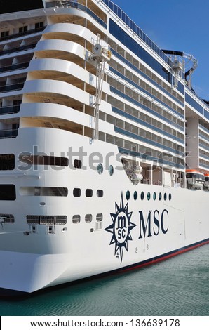 GENOA, ITALY - APRIL 16: the majestic new flagship MSC cruise liner (Preziosa) leaves the port of Genoa for the first cruise April 16, 2013, Genoa, Italy