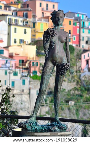 MANAROLA, LA SPEZIA, ITALY,APRIL 26, the woman with grapes, bronze statue by Antonio Puja, Argentine sculptor- April 26 2014, manarola, la spezia, Italy