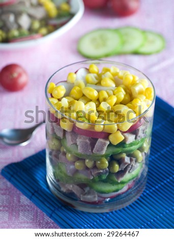 A beef tongue salad with cucumber and maize