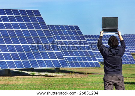 Young man in Central of photovoltaic panels.