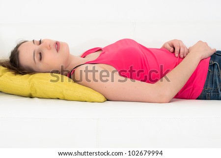 Woman sleeping on a couch in her living room