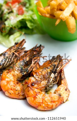 Fried shrimp-delicious fried shrimp with lettuce in white plate