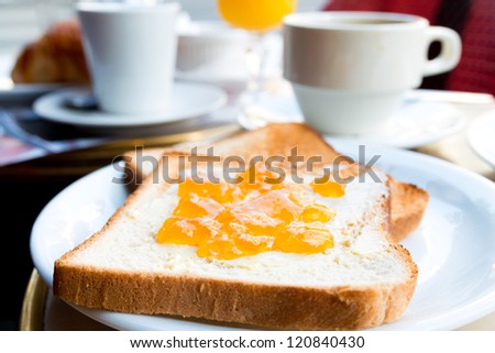 Breakfast with coffee and Toast in a basket on table