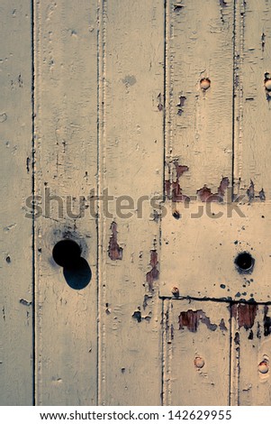 Old wooden door with metal handle