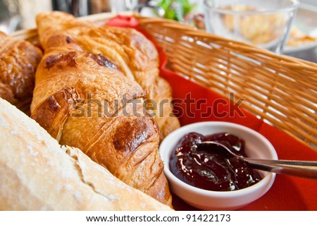 Breakfast - croissants in a basket on table