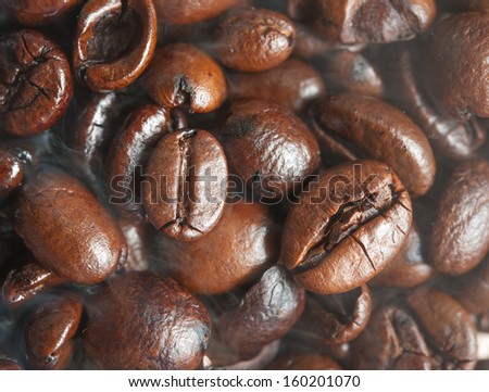 Roasted Coffee bean background with smoke on surface