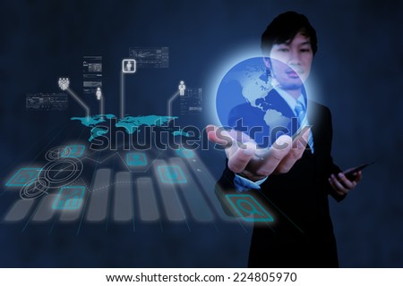 businessman working with new modern computer show the earth social network structure as concept