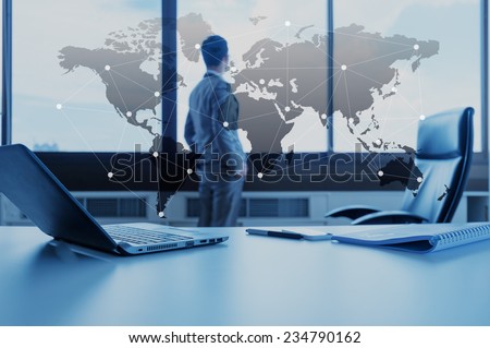 work desk of businessman with laptop, globalization business concept