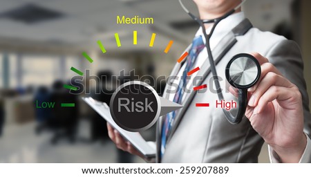 businessman with stethoscope working on risk management, business concept