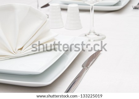 Place setting with white plates