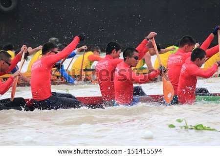 BANGKOK ,THAILAND-AUG 25 : Unidentified rowers in full speed during Thai Long Boat Competition for Long Boat tradition legendary Championship on August 25, 2013 in Bangkok,Thailand.