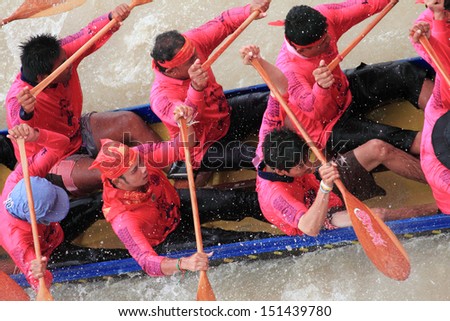 BANGKOK ,THAILAND-AUG 25 : Top view of Unidentified rowers in full speed during Thai Long Boat Competition for Long Boat tradition legendary Championship on August 25, 2013 in Bangkok,Thailand.