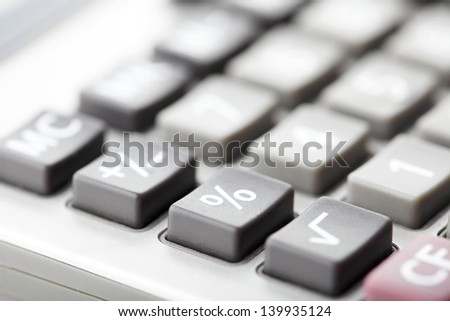 Macro photo of a calculator. Shallow focus, focus on percentage sign.